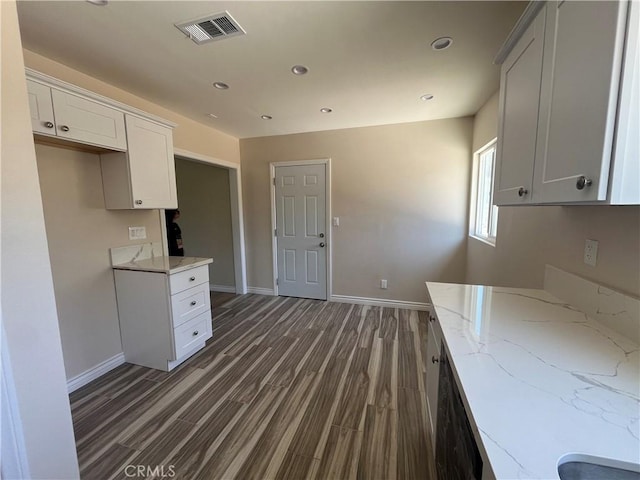 12055 Mount Vernon Ave, Grand Terrace, CA 92313 - kitchen featuring light stone countertops, baseboards, dark wood finished floors, recessed lighting, and white cabinetry