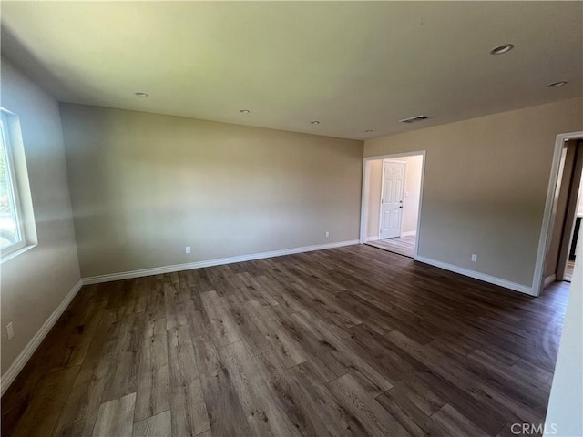 12055 Mount Vernon Ave, Grand Terrace, CA 92313 - spare room with dark wood-style floors and baseboards