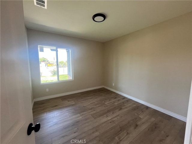 12055 Mount Vernon Ave, Grand Terrace, CA 92313 - empty room featuring baseboards and dark wood finished floors