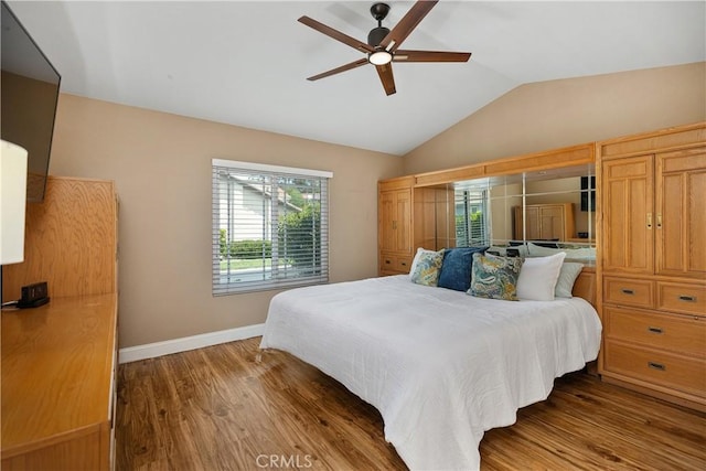 28052 Espinoza, Mission Viejo, CA 92692 - bedroom with multiple windows, vaulted ceiling, baseboards, wood finished floors, and a ceiling fan
