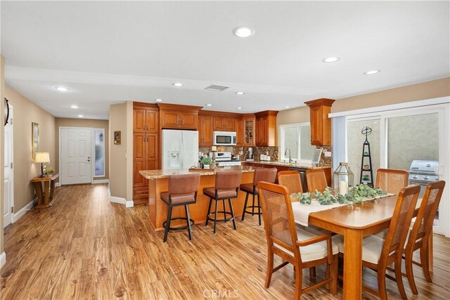 28052 Espinoza, Mission Viejo, CA 92692 - dining area with light wood-style flooring, recessed lighting, and baseboards