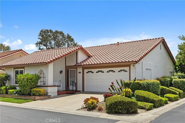 28052 Espinoza, Mission Viejo, CA 92692 - mediterranean / spanish-style home with a garage, a tile roof, and stucco siding