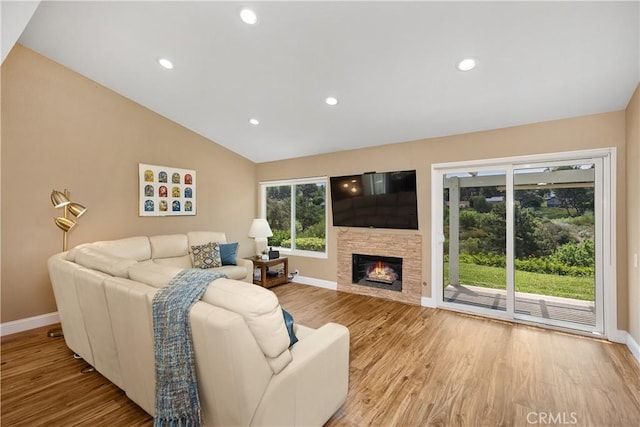 28052 Espinoza, Mission Viejo, CA 92692 - living area with baseboards, wood finished floors, vaulted ceiling, recessed lighting, and a fireplace