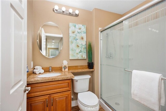 28052 Espinoza, Mission Viejo, CA 92692 - bathroom featuring a shower stall, vanity, and toilet
