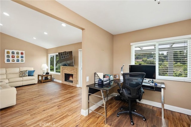 28052 Espinoza, Mission Viejo, CA 92692 - office space featuring wood finished floors, baseboards, a stone fireplace, recessed lighting, and lofted ceiling