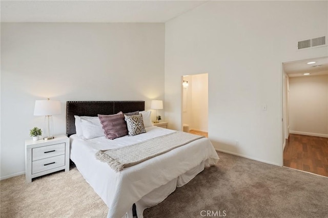 849 E Victoria St Unit 210, Carson, CA 90746 - carpeted bedroom with high vaulted ceiling and baseboards