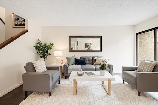 849 E Victoria St Unit 210, Carson, CA 90746 - living room featuring baseboards and wood finished floors