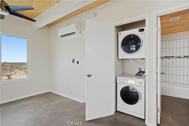 57628 Pine St, Landers, CA 92285 - laundry area featuring estacked washer and dryer, a wall mounted air conditioner, ceiling fan, wooden ceiling, and baseboards