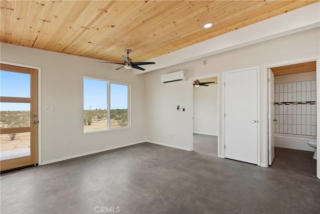 57628 Pine St, Landers, CA 92285 - empty room with a wall unit AC, ceiling fan, finished concrete flooring, wooden ceiling, and baseboards