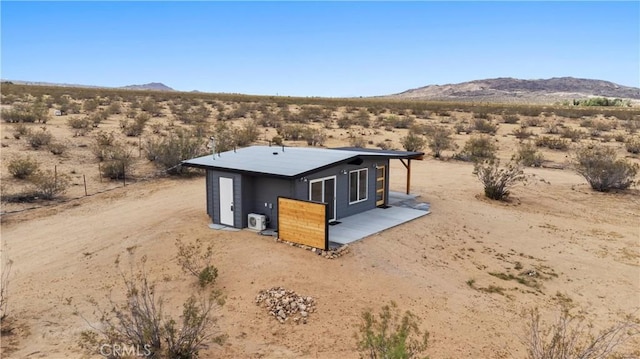 57628 Pine St, Landers, CA 92285 - view of front facade with view of desert, a mountain view, and a rural view