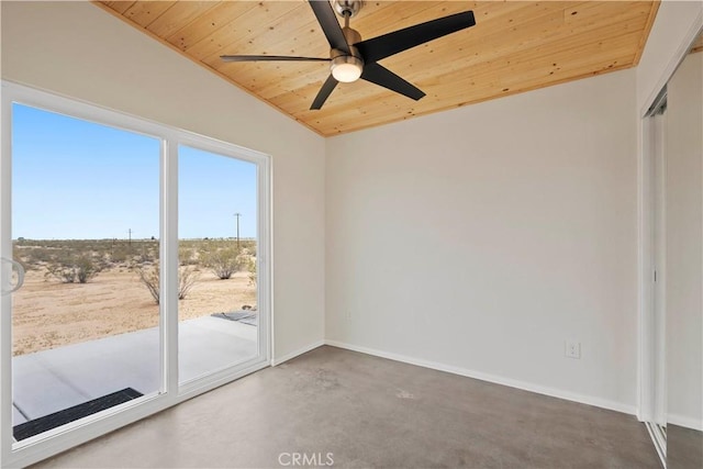 57628 Pine St, Landers, CA 92285 - empty room featuring wooden ceiling, ceiling fan, lofted ceiling, baseboards, and concrete flooring
