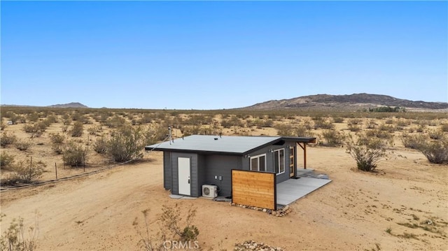57628 Pine St, Landers, CA 92285 - view of outdoor structure featuring view of desert landscape, a mountain view, and a view of rural / pastoral area
