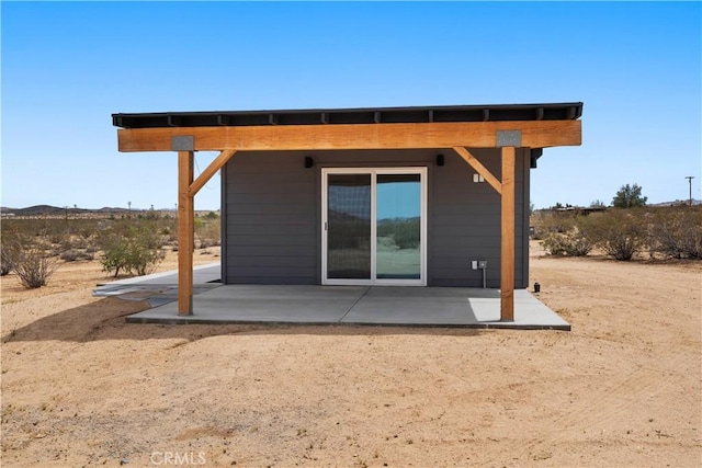 57628 Pine St, Landers, CA 92285 - back of house with a patio area and a mountain view