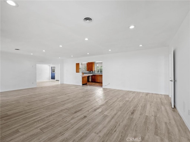 31611 157th St E, Llano, CA 93544 - unfurnished living room featuring recessed lighting, light wood-style flooring, and baseboards
