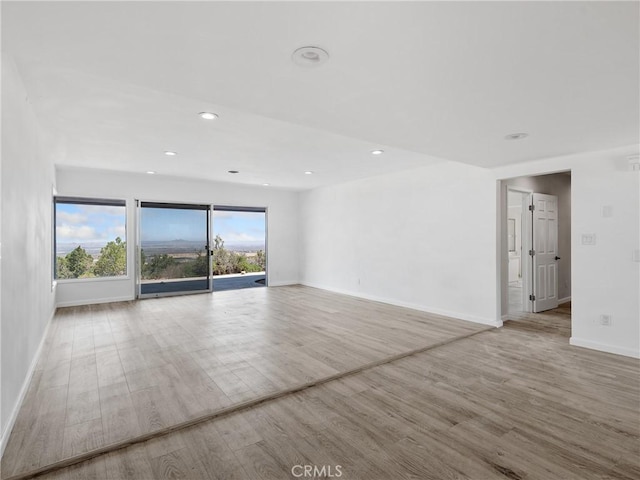 31611 157th St E, Llano, CA 93544 - unfurnished room with baseboards, wood finished floors, and recessed lighting