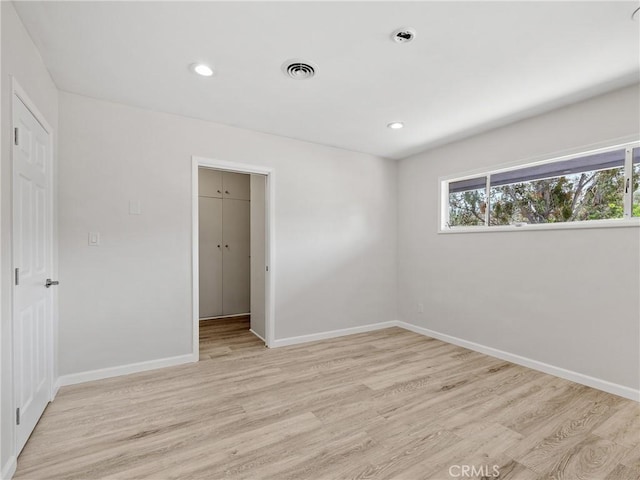 31611 157th St E, Llano, CA 93544 - unfurnished bedroom with light wood-type flooring, baseboards, recessed lighting, a spacious closet, and a closet
