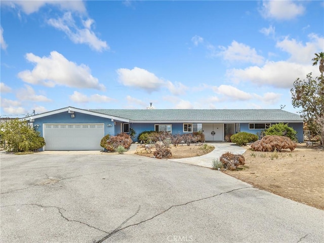 31611 157th St E, Llano, CA 93544 - ranch-style house with asphalt driveway, an attached garage, and stucco siding