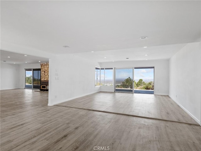 31611 157th St E, Llano, CA 93544 - unfurnished living room featuring recessed lighting, wood finished floors, and baseboards