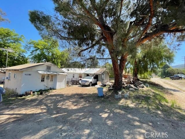 2968 Mill Creek Rd, Mentone, CA 92359 - view of front of property with dirt driveway