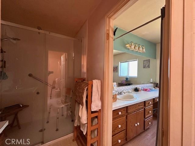 2968 Mill Creek Rd, Mentone, CA 92359 - bathroom featuring vanity and a shower stall