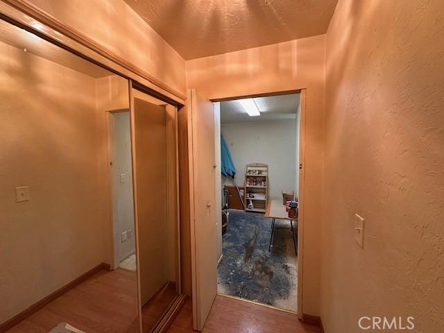 2968 Mill Creek Rd, Mentone, CA 92359 - hall featuring wood finished floors