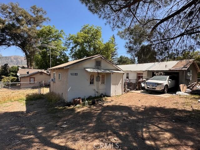 2968 Mill Creek Rd, Mentone, CA 92359 - back of property with dirt driveway