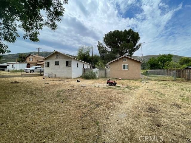 2968 Mill Creek Rd, Mentone, CA 92359 - view of property exterior featuring an outdoor fire pit