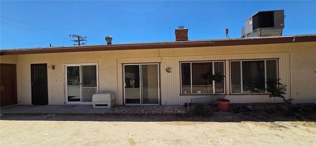 56994 Crestview Dr, Yucca Valley, CA 92284 - back of property featuring a chimney and central AC