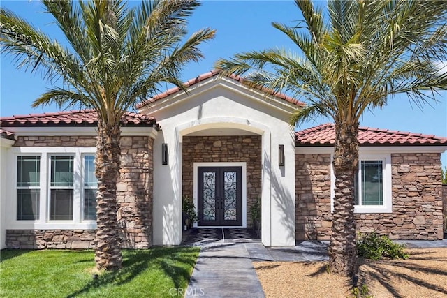 14258 Crow Rd, Apple Valley, CA 92307 - doorway to property with stone siding, french doors, and a tiled roof