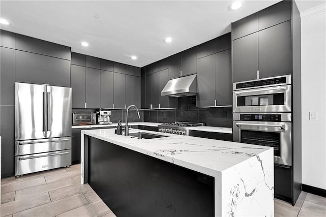14258 Crow Rd, Apple Valley, CA 92307 - kitchen with appliances with stainless steel finishes, range hood, a sink, dark cabinetry, and recessed lighting