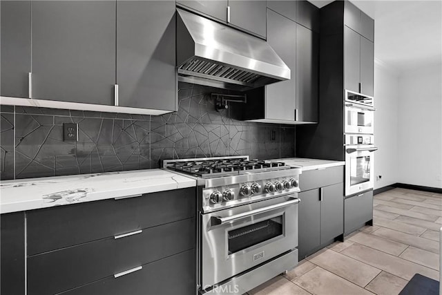 14258 Crow Rd, Apple Valley, CA 92307 - kitchen with appliances with stainless steel finishes, range hood, tasteful backsplash, and light stone counters