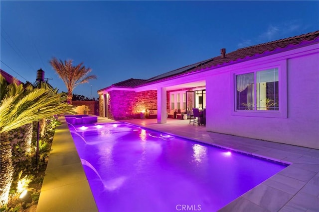 14258 Crow Rd, Apple Valley, CA 92307 - pool at twilight featuring a patio, a pool with connected hot tub, and an outdoor living space