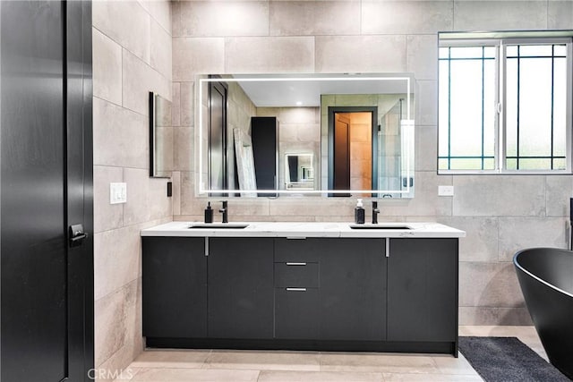 14258 Crow Rd, Apple Valley, CA 92307 - full bath featuring double vanity, a freestanding bath, and tile walls
