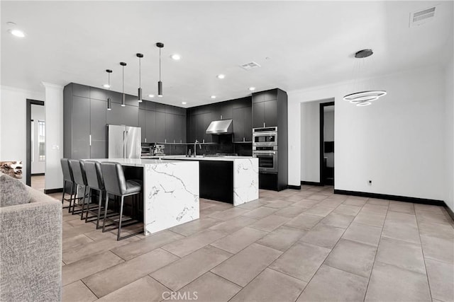 14258 Crow Rd, Apple Valley, CA 92307 - kitchen with stainless steel appliances, a large island, under cabinet range hood, ornamental molding, and modern cabinets