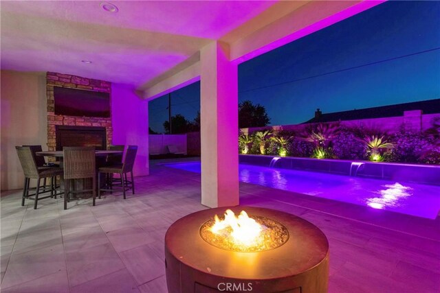 14258 Crow Rd, Apple Valley, CA 92307 - view of patio / terrace with an outdoor fire pit, an outdoor pool, and outdoor dining space