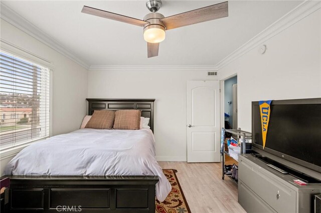 1126 W 13th St Unit 1, San Pedro, CA 90731 - bedroom featuring crown molding, light wood-style flooring, a ceiling fan, and baseboards