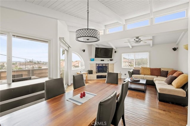 1126 W 13th St Unit 1, San Pedro, CA 90731 - dining space with wood finished floors, a fireplace with raised hearth, a ceiling fan, and wood ceiling