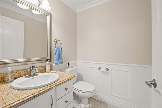 1126 W 13th St Unit 1, San Pedro, CA 90731 - bathroom featuring crown molding, vanity, toilet, a wainscoted wall, and tile patterned flooring