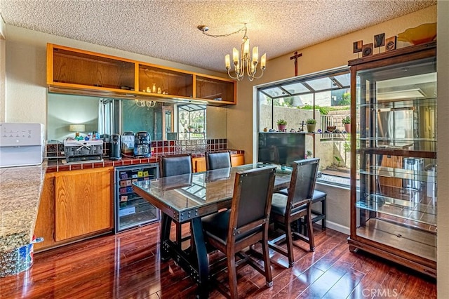 1130 Whitewater Dr Unit 263, Fullerton, CA 92833 - dining area featuring wine cooler, a textured ceiling, a chandelier, and dark wood finished floors