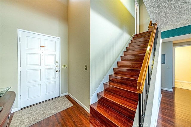 1130 Whitewater Dr Unit 263, Fullerton, CA 92833 - entrance foyer with wood finished floors, stairs, and baseboards
