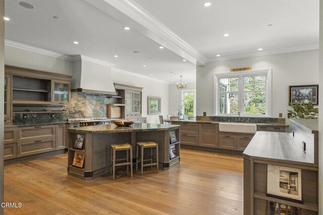 2112 Trentham Rd, Triunfo Pass-Point Mugu, CA 91361 - kitchen with open shelves, premium range hood, a kitchen breakfast bar, a center island, and recessed lighting