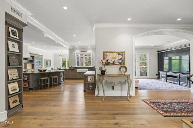 2112 Trentham Rd, Triunfo Pass-Point Mugu, CA 91361 - hallway with arched walkways, wood finished floors, ornamental molding, and recessed lighting