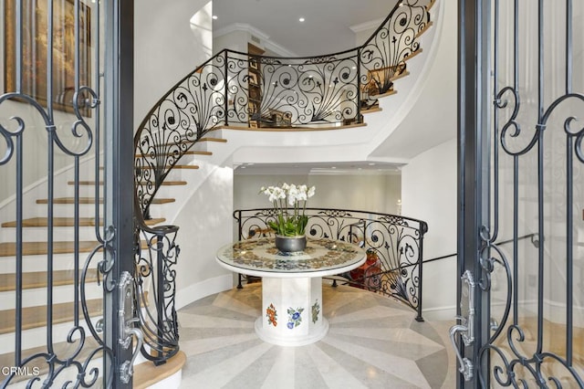 2112 Trentham Rd, Triunfo Pass-Point Mugu, CA 91361 - entryway featuring stairs, a high ceiling, and crown molding