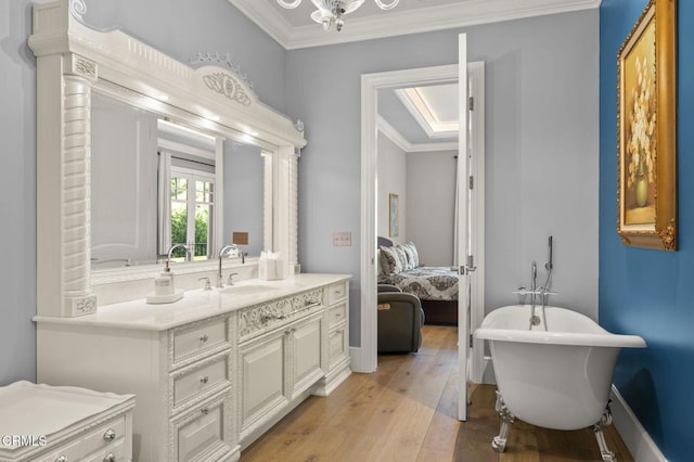 2112 Trentham Rd, Triunfo Pass-Point Mugu, CA 91361 - full bathroom with vanity, a freestanding tub, crown molding, hardwood / wood-style floors, and connected bathroom