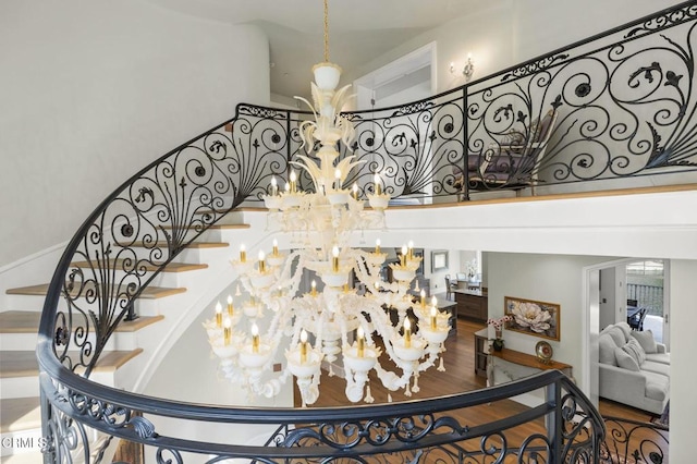 2112 Trentham Rd, Triunfo Pass-Point Mugu, CA 91361 - stairway featuring a chandelier, a high ceiling, and wood finished floors