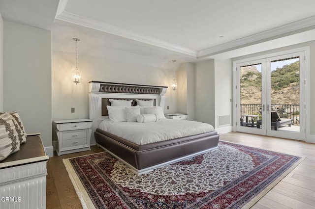 2112 Trentham Rd, Triunfo Pass-Point Mugu, CA 91361 - bedroom featuring a raised ceiling, access to exterior, wood finished floors, french doors, and crown molding