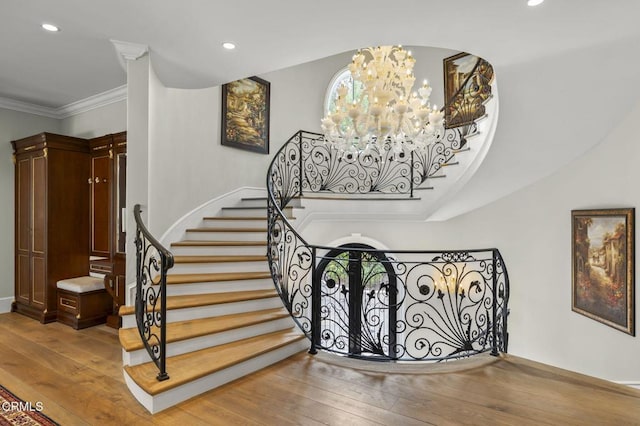 2112 Trentham Rd, Triunfo Pass-Point Mugu, CA 91361 - stairs featuring hardwood / wood-style floors, recessed lighting, crown molding, and a chandelier
