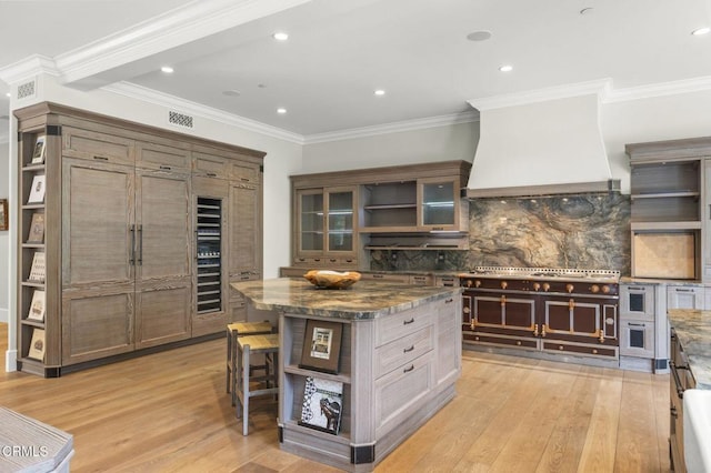 2112 Trentham Rd, Triunfo Pass-Point Mugu, CA 91361 - kitchen with open shelves, light wood-style flooring, backsplash, custom exhaust hood, and recessed lighting