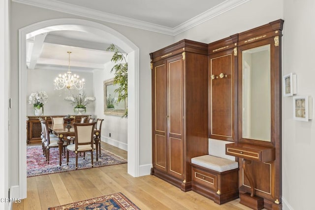 2112 Trentham Rd, Triunfo Pass-Point Mugu, CA 91361 - mudroom with light wood-style floors, arched walkways, ornamental molding, and a chandelier