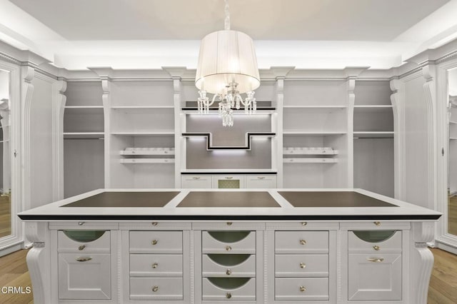 2112 Trentham Rd, Triunfo Pass-Point Mugu, CA 91361 - walk in closet featuring light wood-style floors and a chandelier